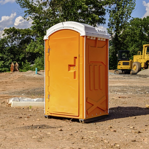 what is the cost difference between standard and deluxe portable restroom rentals in Cardington